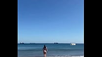 GIRL WALKING ON THE BEACH