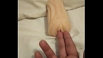 Playing with artificial pussy