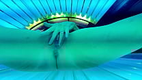 Trixie has fun in the tanning bed