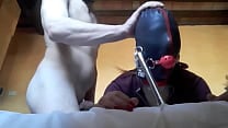 Tied to a machine  masked and hooded  she has to suck a big cock Tied to a machine  masked and hooded  she has to suck a big cock