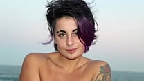 beautiful tattooed woman with colored hair