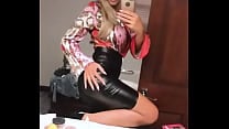 Blonde in tight leather skirt getting ready to go out Blonde in tight leather skirt getting ready to go out