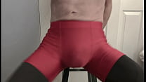 Grinding on Stool in Black Compression Tights and Red Compression Shorts Grinding on Stool in Black Compression Tights and Red Compression Shorts