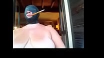 Slut wife bound hooded and smoking with holder even outdoors