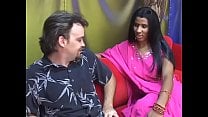 Young Indian lady gives an older man a blow job on a red couch Young Indian lady gives an older man a blow job on a red couch