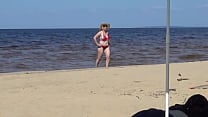 Nimble mature mommy has fun with young guys on the beach