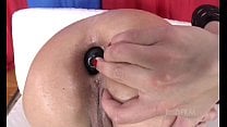 Slut filling her ass with a big dildo