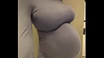 Pregnant stepmother with big milky tits in a tight dress