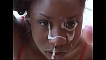 A beautiful dark skinned bitch sucks and swallows a big dick of a stud and he fills her face with sperm