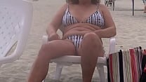 I enjoy a huge cock on the beach after flashing myself he licks my hairy pussy and gives me a huge cumshot