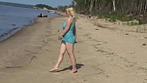 Milf teases pussy on the beach