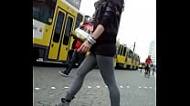 Candid girl in short skirt grey leggings and high heel ankle boots Candid girl in short skirt grey leggings and high heel ankle boots