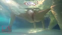 Elegant and flexible babe  swimming underwater in the outdoor swimming pool  2