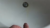 Boy is Pissing in the Sink and makes stinky farts Boy is Pissing in the Sink and makes stinky farts