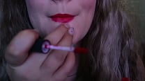 CUTE WOMAN PAINTS HER LIPS RED AND SMOKES a CIGARETTE  I HOPE YOU LIKE IT