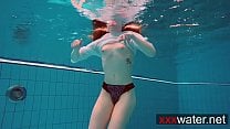 Pierced teen swimming Pierced teen swimming