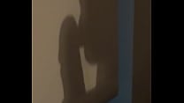 The shadow reflects her sucking his cock