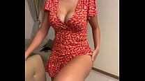 My stepmom is sitting in a red dress and showing her tits