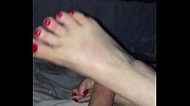 Wife rsquo s sexy feet giving a great footjob foot fetish red toes UK British
