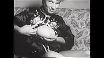 Gorgeous blonde strips in front of the camera and caresses her big firm breasts in retro clip 50s Gorgeous blonde strips in front of the camera and caresses her big firm breasts in retro clip 50s