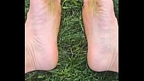Feet flexing in the grass   
