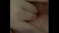 Woman fingers herself to orgasm